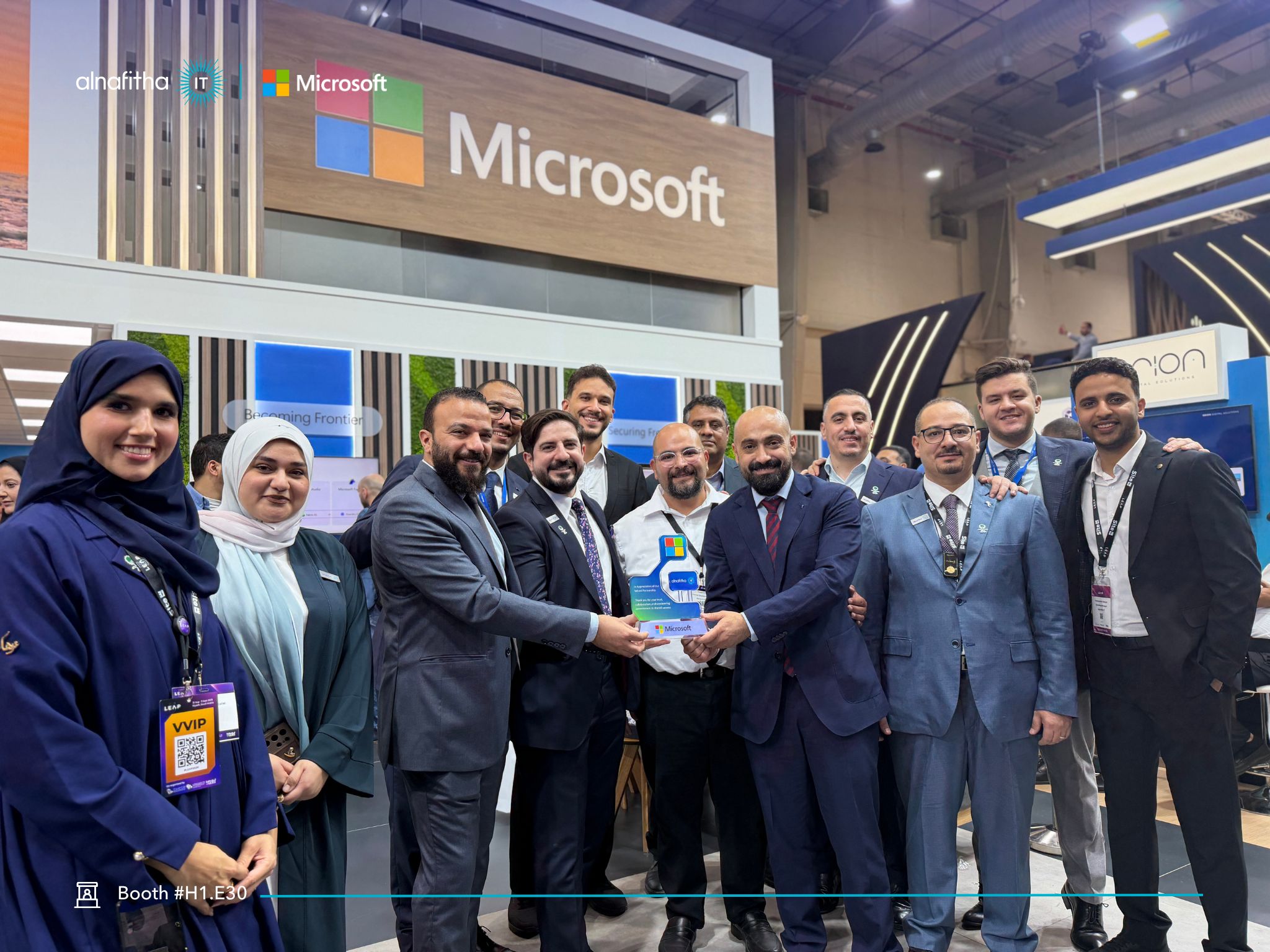 Alnafitha IT team receiving Microsoft appreciation plaque at LEAP 2026 booth